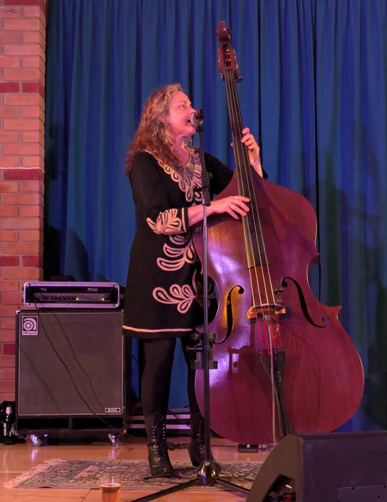 Amy Lavere playing upright double bass and singing